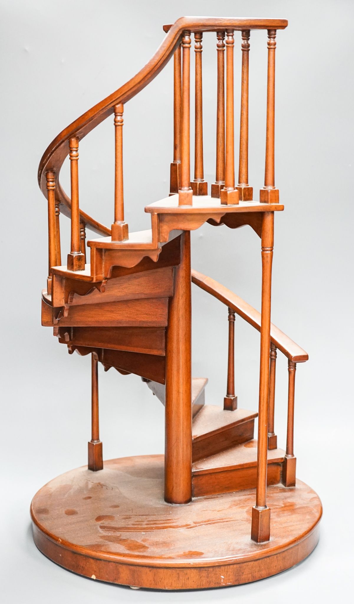 A large mahogany model of a spiral staircase 61cm